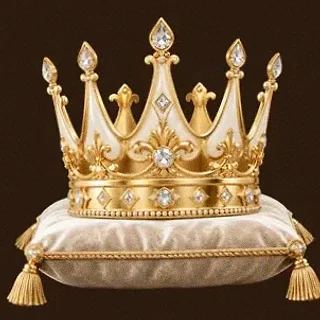 Gold crown on cushion — Cashmo